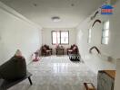 Spacious living room with tiled floor and large window