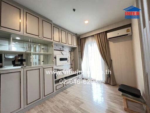 Modern living room with built-in cabinetry and large window with curtains