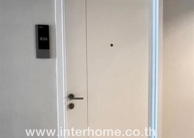 Entrance door with visible door number and intercom