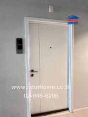 Entrance door with visible door number and intercom