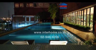 Outdoor swimming pool of a building at night