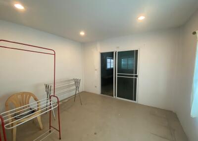 Bright living area with sliding glass door and recessed lighting