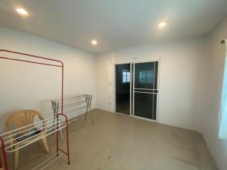 Bright living area with sliding glass door and recessed lighting