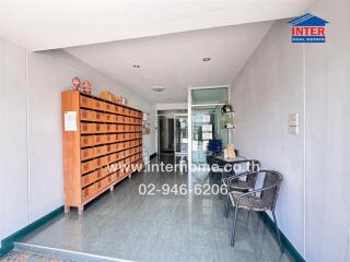 Lobby area with mailboxes and seating