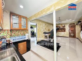 Kitchen and adjoining exercise area with modern fixtures and decor