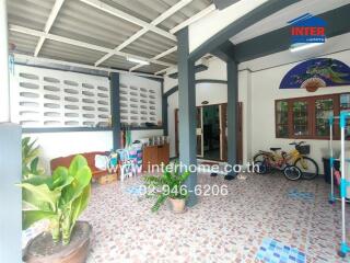 Covered patio area with plants