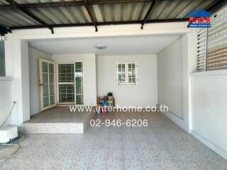 Front view of a house with a tiled porch