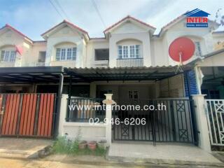 Two-story townhouse with front yard and gated entrance