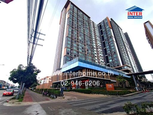 Modern high-rise residential building with retail space on ground floor