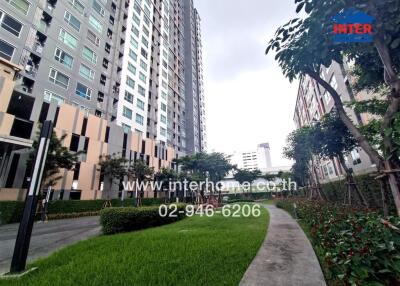 Residential building exterior with pathway and greenery