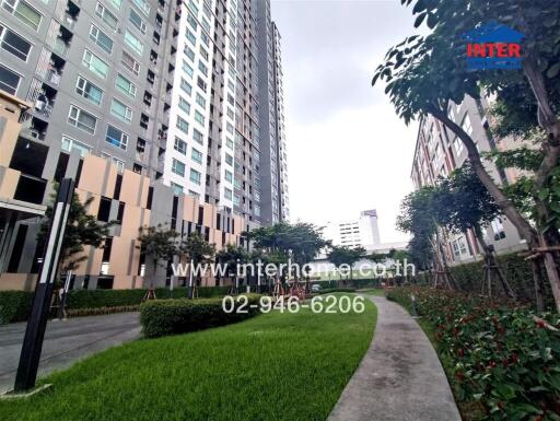 Residential building exterior with pathway and greenery