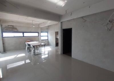 Spacious dining area with large windows and abundant natural light