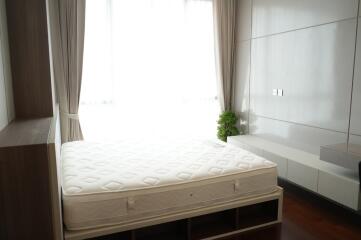 Modern bedroom with large window and natural light