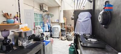 Outdoor kitchen with appliances and cooking area