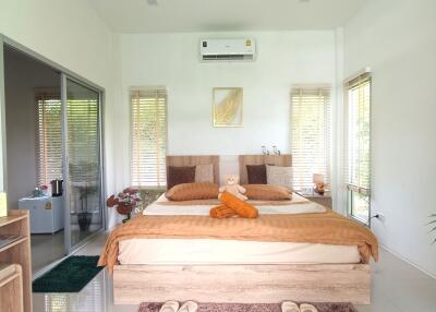 Spacious bedroom with modern decor and double bed