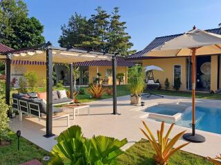 Outdoor patio and pool area with pergola