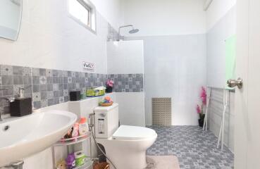 Modern bathroom with tiled walls and floors