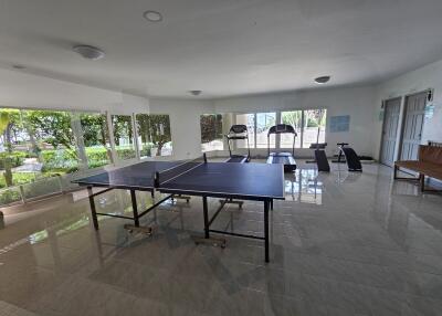 Recreational room with gym equipment and table tennis