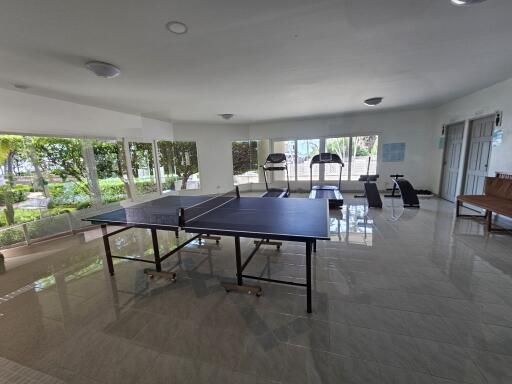 Recreational room with gym equipment and table tennis