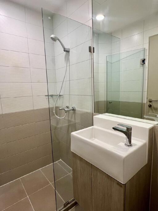 Modern bathroom with glass shower and sink