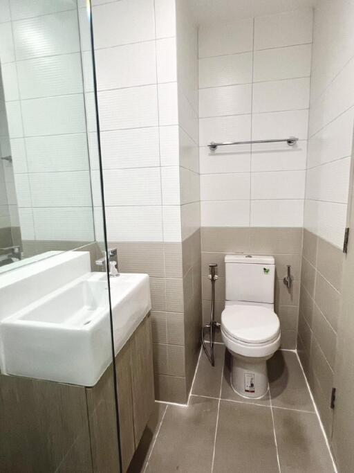 Modern bathroom with tiled walls and floor