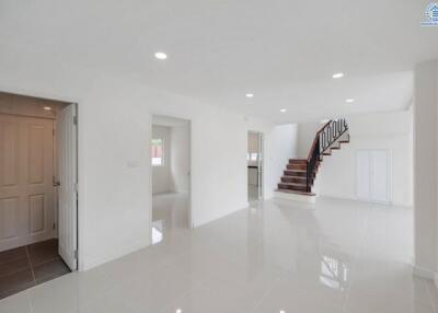 Spacious modern main living area with staircase