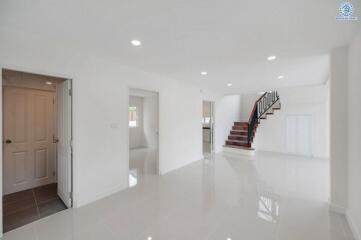 Spacious modern main living area with staircase