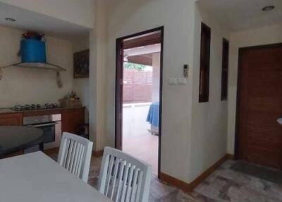 Modern kitchen with dining area and outdoor access