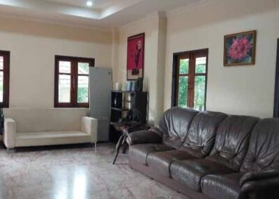 Spacious living room with seating and natural light