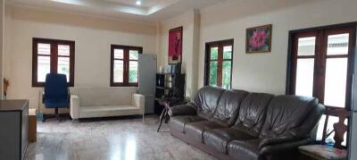 Spacious living room with seating and natural light