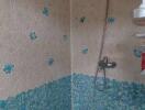 Shower area in a bathroom with floral tile patterns