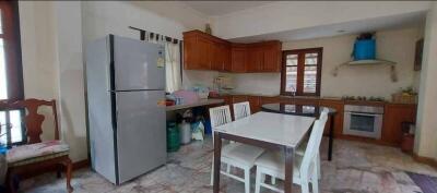 Spacious kitchen with modern appliances and a dining area