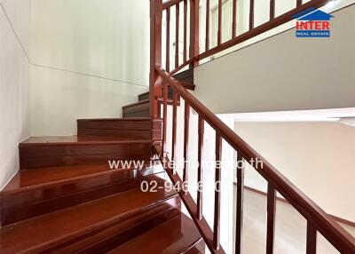 Wooden staircase with railing in a house