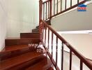 Wooden staircase with railing in a house