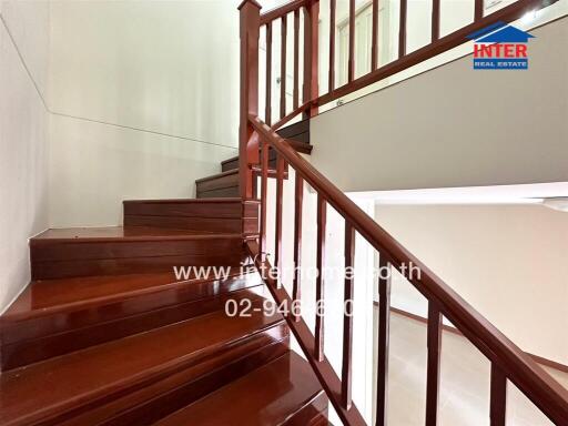 Wooden staircase with railing in a house