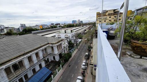 View from a high-rise building overlooking a street and industrial area