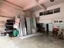 Spacious industrial workshop with materials and storage