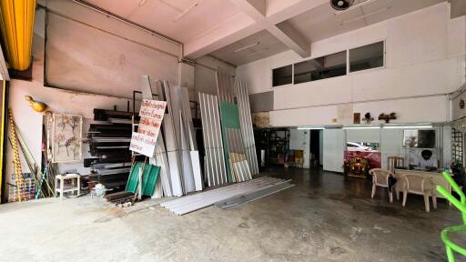 Spacious industrial workshop with materials and storage
