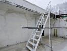 Rooftop with ladder and exposed construction equipment