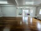 Spacious main living area with wooden flooring