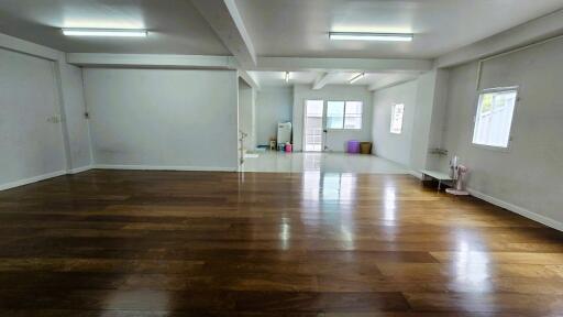 Spacious main living area with wooden flooring