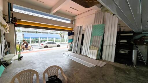 Interior view of a garage with open door