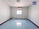 Empty bedroom with tiled floor and a small window