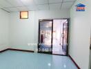 Living room with large sliding doors and tiled flooring