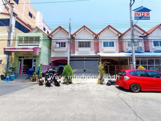 External view of residential buildings with street parking