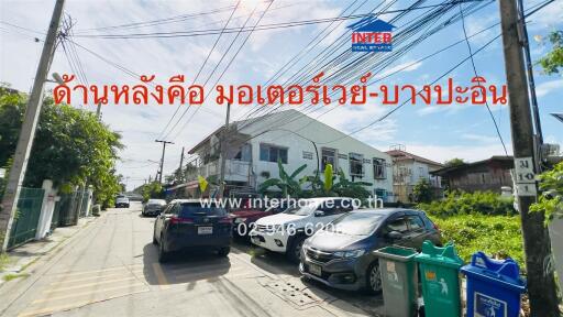 Street view of residential area with houses and parked cars