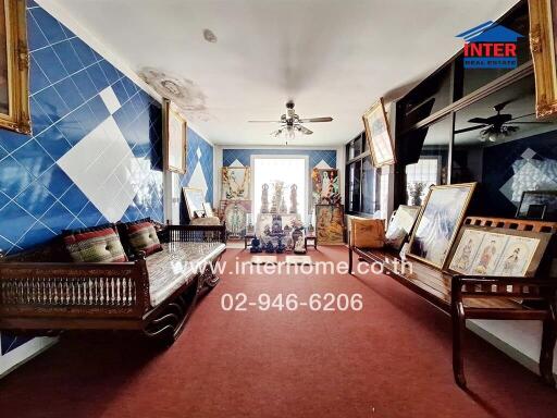 Traditional living room with decorative items and blue tiled walls