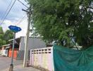 Street view with nearby building and foliage