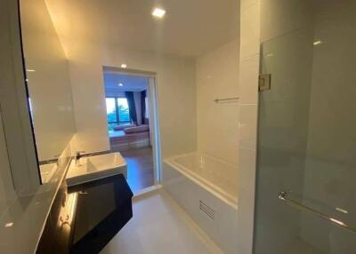 Modern bathroom with sink, bathtub, and shower