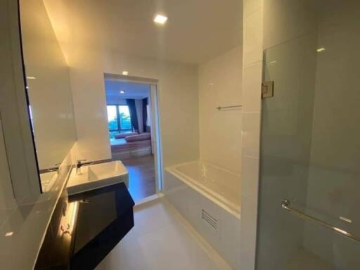 Modern bathroom with sink, bathtub, and shower